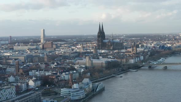 AERIAL: Wide Shot of Cologne Germany and Rhine River From the Air with Majestic Cathedral on Sunny