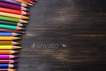 A Vibrant Array of Colored Pencils on a Rustic Wooden Table