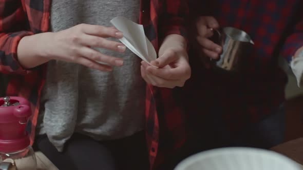 Female Barista Making Filtered Coffee