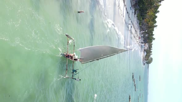 Vertical Video Boats in the Ocean Near the Coast of Zanzibar Tanzania Aerial View