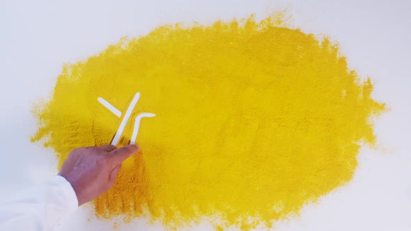 Hand Writes On Turmeric Yellow