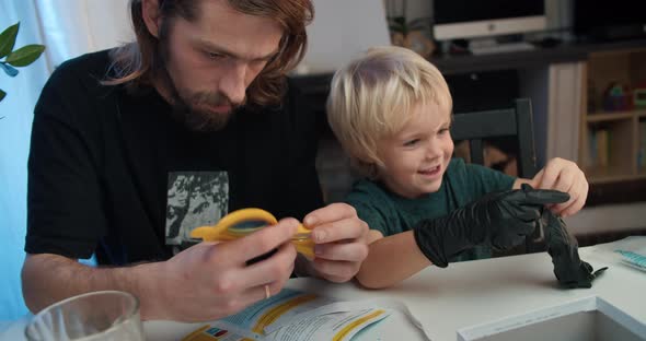 Cheerful Family Preparing to Learn Make Chemical Experiment at Home