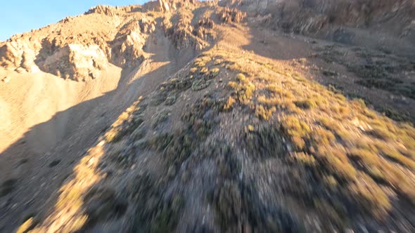 Cliff Rock and Mountain Surfing with a FPV Drone in a Desert and Moon Like Sandy and Rocky Landscape