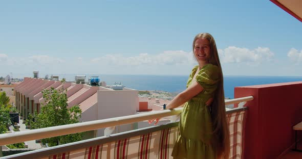 Attractive Young Woman Very Long Blonde Hair Smiling Happy Balcony Ocean View and Cityscape