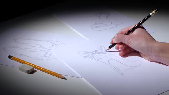 Shoe Designer Creates Sketch for a Youth Brand. Close Up