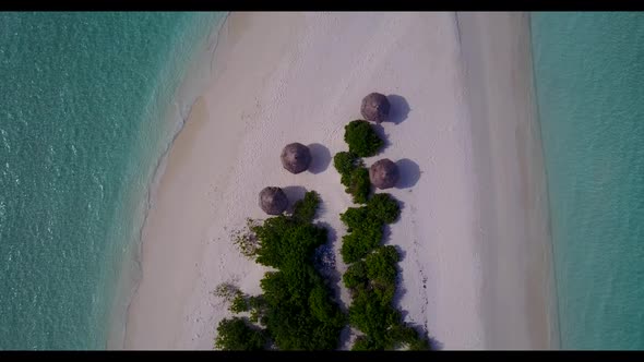 Aerial top down scenery of perfect lagoon beach voyage by blue sea and white sand background of a pi