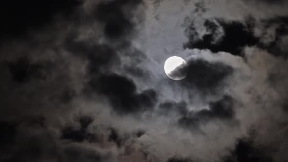 Full Moon Moving in Clouds