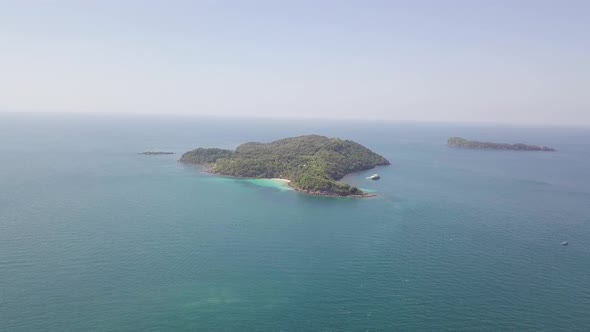 Aerial View of a Small Island Lagoon in the Middle of the Blue Ocean.