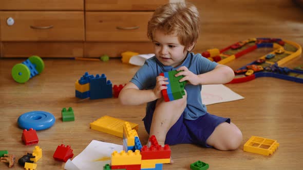 Kid Playing with Constructor Toys