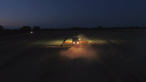 Combine Harvester at Night During the Harvest
