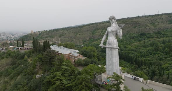 Aerial dolly in shot of the massive Mother of Georgia monument in Tbilisi.