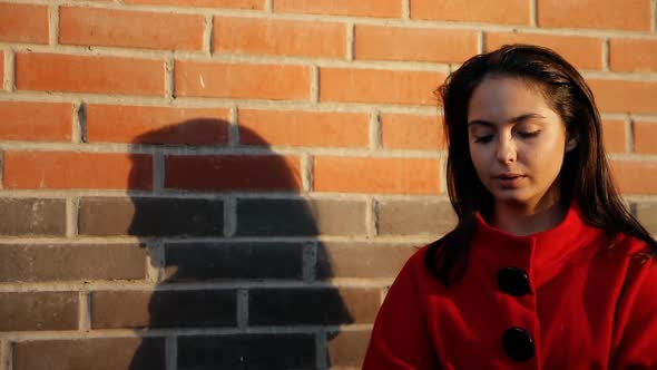 A Young Woman Smokes a Cigarette