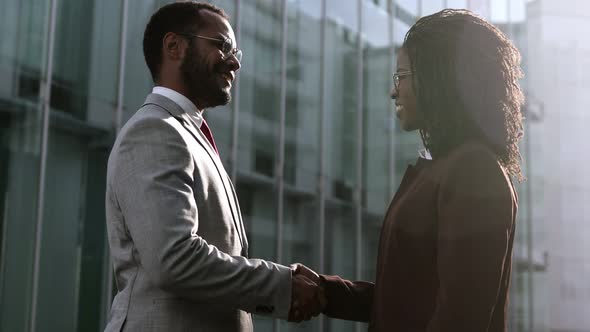 Two Young People Shaking Hands Outdoor