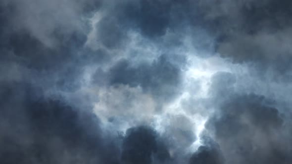 a flash of lightning as a thunderstorm  in the dark cumulonimbus clouds