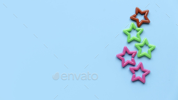 ce satisfaction. Five colorful star on blue background with copy space.