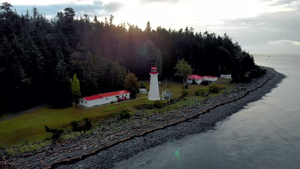 Vancouver Island Canada Quadra Island Old Historical Lighthouse at Cape Mudge Couple in Yellow Rain