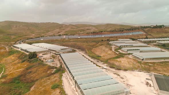 Aerial footage of large greenhouse farm in the Jordan vally in Israel