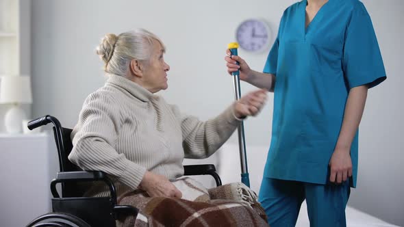 Talkative Old Lady in Wheelchair Gossiping With Hospital Janitor, Loneliness