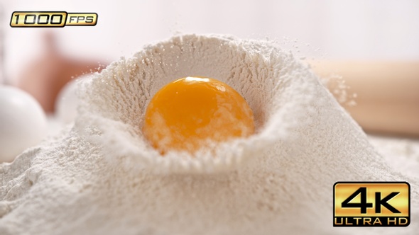 Egg Yolk Rolling Down the Pile of Flour