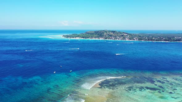 Aerial texture of marine tourist beach break by clear lagoon with white sand background of a dayout 