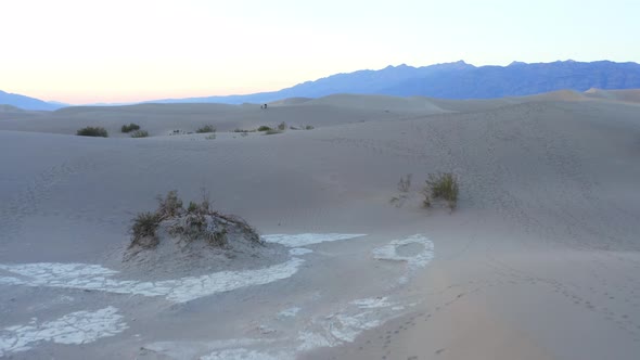 Flight in the endless hot desert over sand dunes. Death Valley