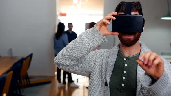 Male executive using virtual reality headset