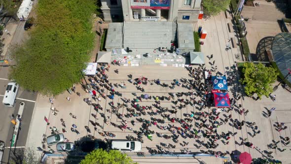 Sinking View of an Anti-Mask Protest Rally, wide daytime aerial in UHD