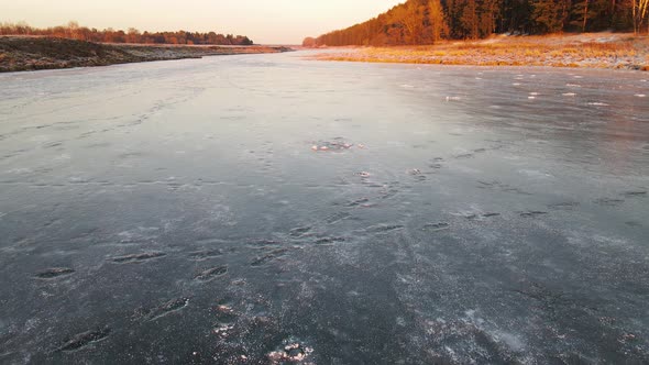 The Frozen Surface of the Lake is Covered with Ice Aerial View