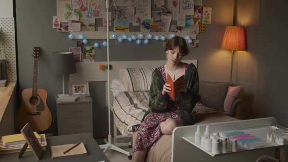 Girl with Book Posing in Hospital Room