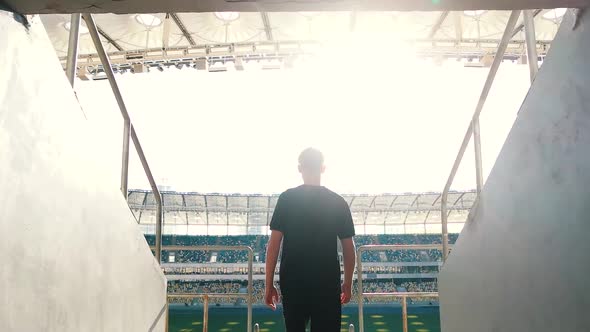 Guy Goes To the Podium of the Stadium