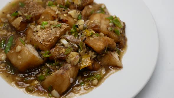 Close-Up Footage of Deep Fried Seabass Stir Fried With Chilli and Garlic Sauce, Hot and Spicy Thai D