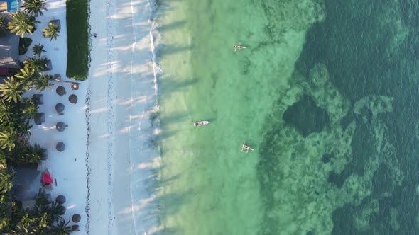 Vertical Video Boats in the Ocean Near the Coast of Zanzibar Tanzania Aerial View