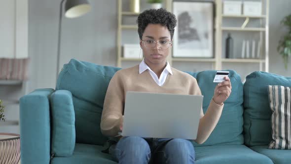 Young African Girl Trying To Use Credit Card Online