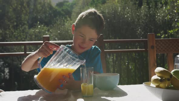 Family eating breakfast together outdoors