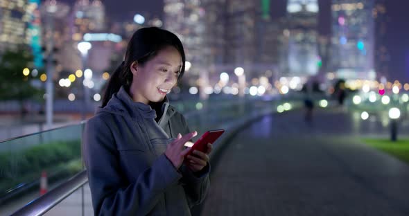 Woman use of smart phone at night