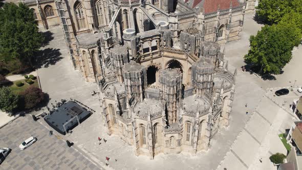 Majestic building of Batalha Monastery, aerial orbit view