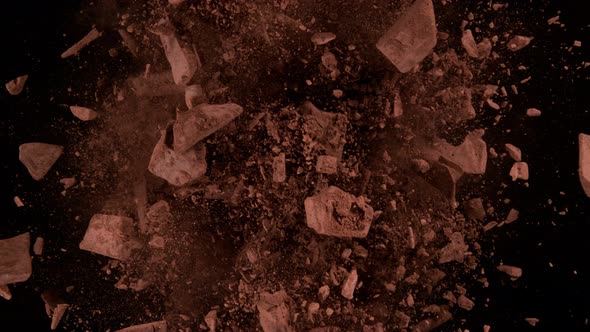 Super Slow Motion Shot of Rotating Chocolate Chunks and Cocoa Powder Explosion at 1000Fps alt
