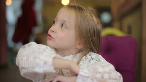 Close up portrait of adorable 3 years old girl, little girl looking at the camera