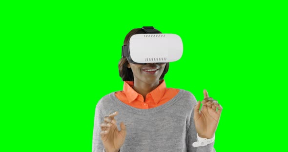 Woman gesturing while using virtual reality headset 