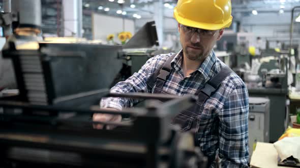 An Engineer a Worker Working on a Milling Machine