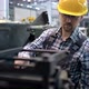 An Engineer a Worker Working on a Milling Machine - VideoHive Item for Sale