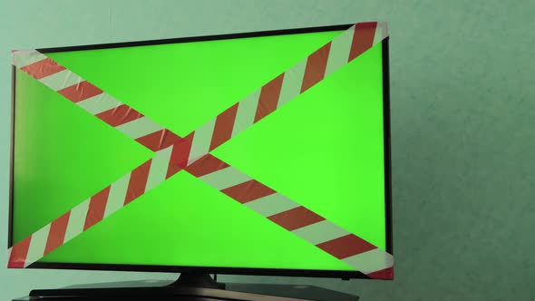 TV Screen with Forbidden Tape and Green Chroma Key Screen