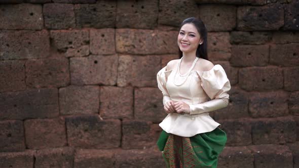 slow motion of happy beautiful woman in Thai traditional dress