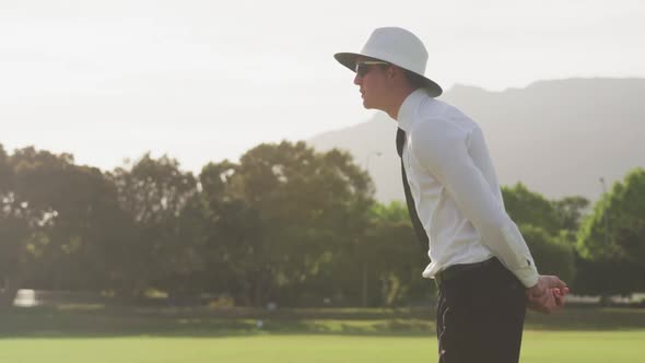 Cricket umpire making signs standing on a cricket pitch