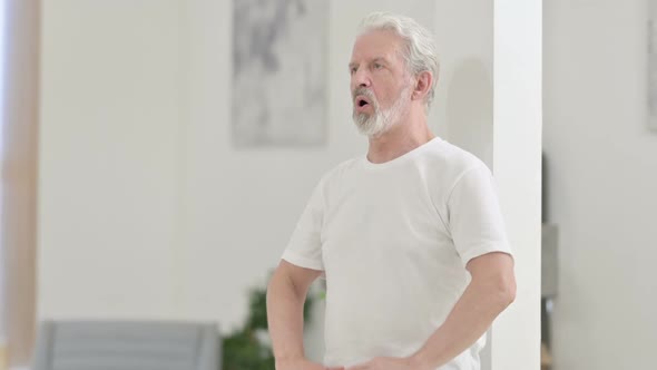 Close Up of Legs of Old Man Doing Yoga at Home