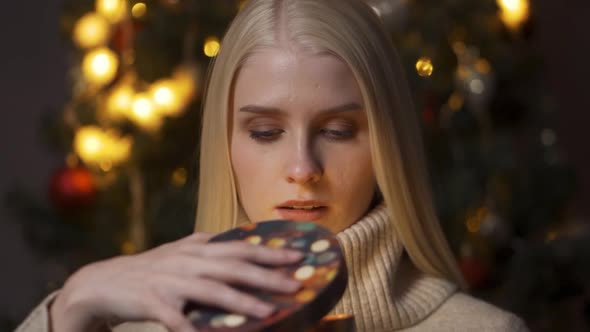 Young Happy Woman Opening Present Box Closeup