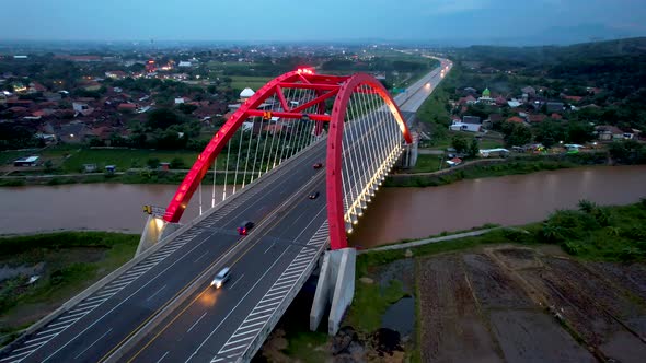 Aerial view of the Kalikuto Bridge, an Iconic Red Bridge at Trans Java Toll Road