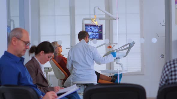 Dentist Doctor Working in Crowded Office