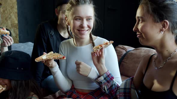 The Young Guys Have Fun and Eat Pizza During a Break