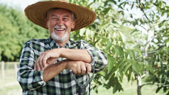 Handheld video portrait of happy farmer in a straw hat. Shot with RED helium camera in 8K